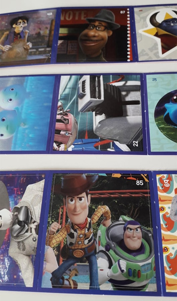 Exemples autocollants Pixar reus en caisse chez Cora